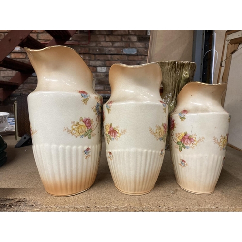 428 - THREE BLUSH IVORY JUGS BY CROWN DEVON IN GRADUATING SIZES