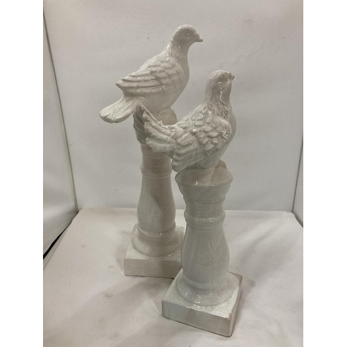 444 - TWO VINTAGE STYLE COLUMNS WITH PIGEONS HEIGHTS 45CM AND 39CM