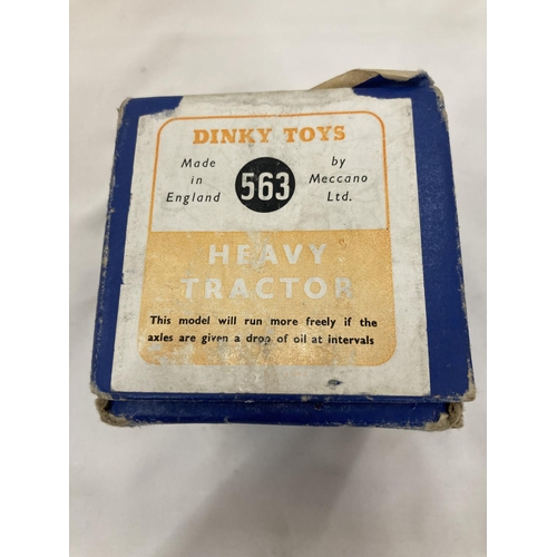 446 - A DINKY TOYS HEAVY TRACTOR NUMBER 563 - BOXED, AND A DINKY TOYS WHEELBARROW