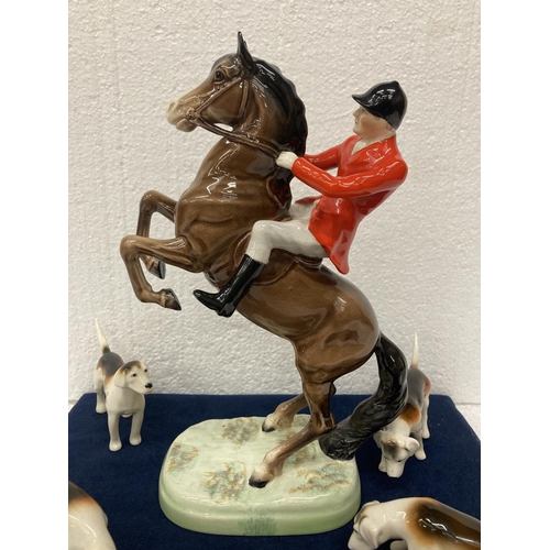 778 - A BESWICK 'REARING HUNTSMAN' MODEL NUMBER 868 HEIGHT 25CM/10 INCHES, A FOX AND FOUR HOUNDS.  ALL IN ... 