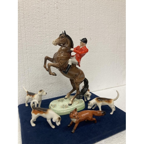 778 - A BESWICK 'REARING HUNTSMAN' MODEL NUMBER 868 HEIGHT 25CM/10 INCHES, A FOX AND FOUR HOUNDS.  ALL IN ... 