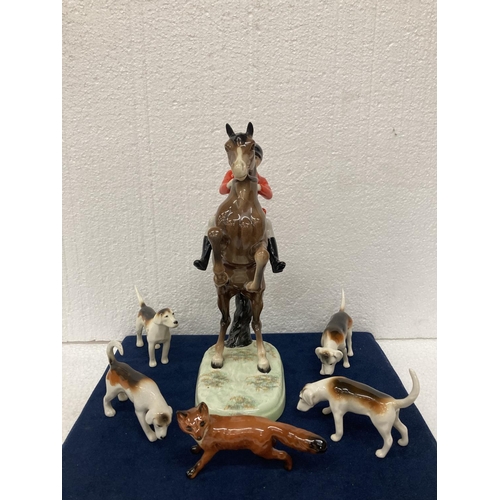 778 - A BESWICK 'REARING HUNTSMAN' MODEL NUMBER 868 HEIGHT 25CM/10 INCHES, A FOX AND FOUR HOUNDS.  ALL IN ... 