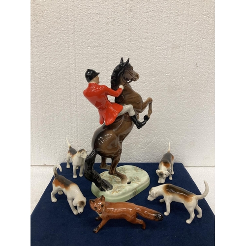 778 - A BESWICK 'REARING HUNTSMAN' MODEL NUMBER 868 HEIGHT 25CM/10 INCHES, A FOX AND FOUR HOUNDS.  ALL IN ... 