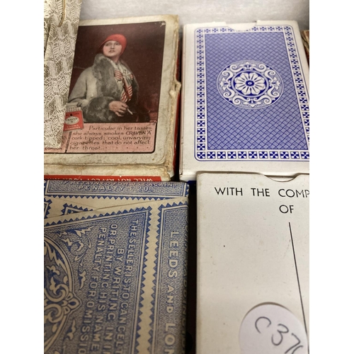 854 - A QUANTITY OF VINTAGE PLAYING CARDS