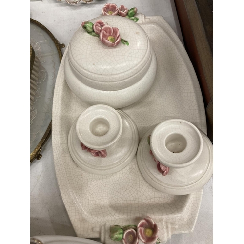 863 - A 'PETIT POINT' TRAY, BRUSHES AND MIRROR SET WITH BACK EMBROIDERY PLUS THREE DRESSING TABLE SETS