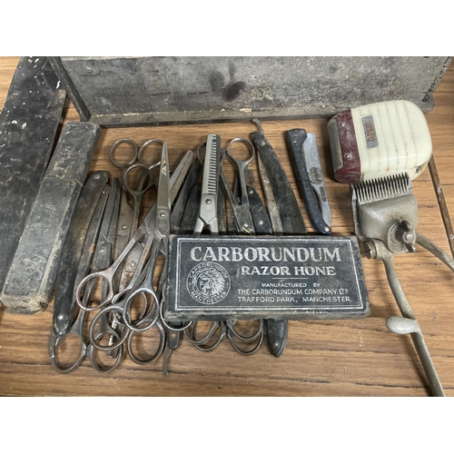 888 - A COLLECTION OF VINTAGE BARBERS SHOPS TOOLS TO INCLUDE CUT THROAT RAZORS, SCISSORS, CLIPPERS, SHARPE... 