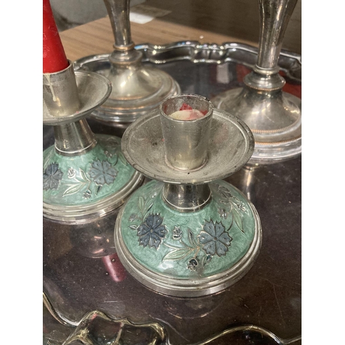 889 - A QUANTITY OF SILVER PLATED ITEMS TO INCLUDE A TRAY AND FOUR CANDLESTICKS, TWO WITH ENAMELLING TO TH... 