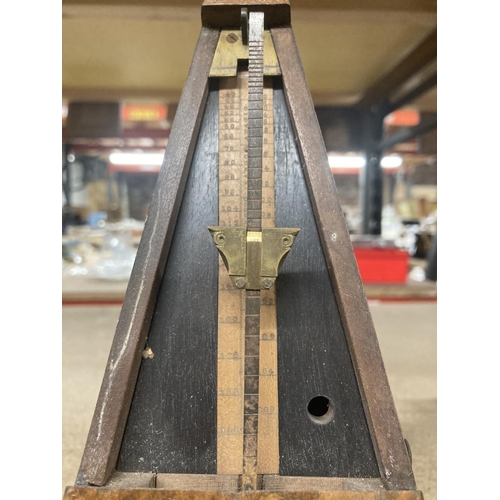 895 - A WALNUT CASED VINTAGE METRONOME, MADE IN LONDON