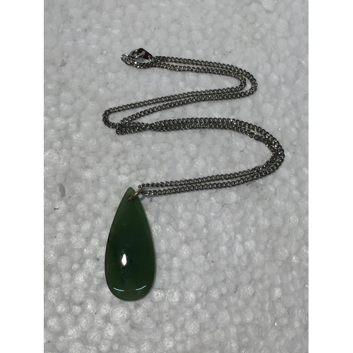 689 - A SILVER CHAIN WITH A JADE PENDANT - BOXED