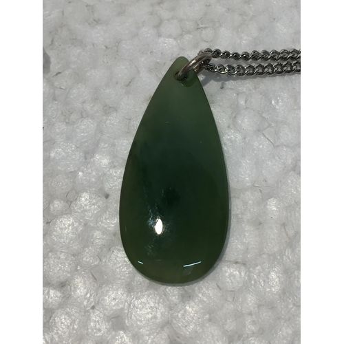 689 - A SILVER CHAIN WITH A JADE PENDANT - BOXED