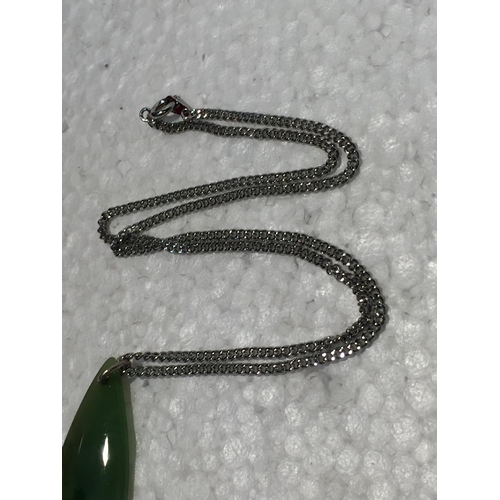 689 - A SILVER CHAIN WITH A JADE PENDANT - BOXED