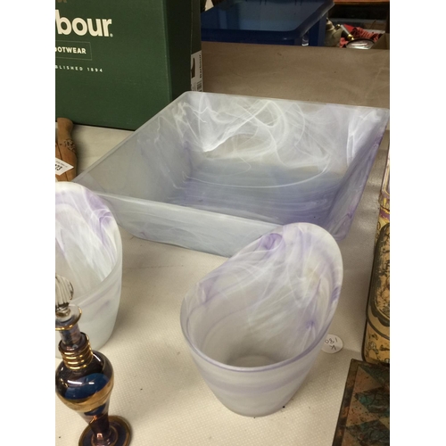 924 - A LARGE LILAC MARBLE EFFECT BOWL, TWO CANDLE HOLDERS PLUS AN IRRIDESENT SCENT BOTTLE