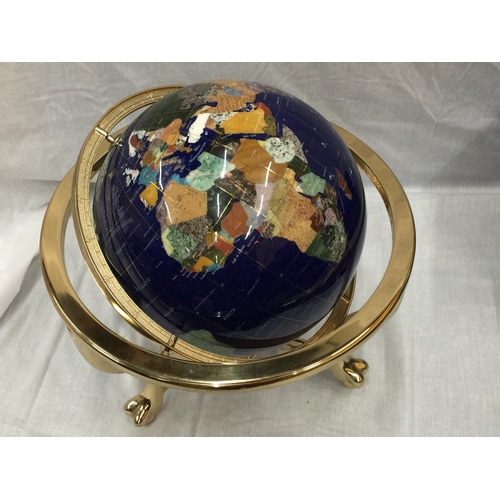 12 - A GLOBE WITH MOTHER OF PEARL INLAYS ON BRASS ROTATING STAND H: 45CM