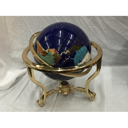 12 - A GLOBE WITH MOTHER OF PEARL INLAYS ON BRASS ROTATING STAND H: 45CM