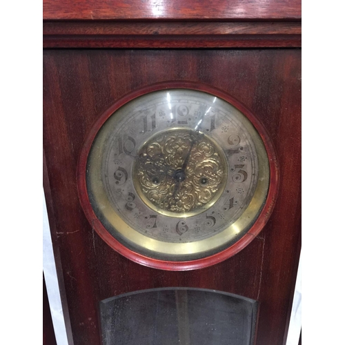 21 - AN ART NOUVEAU STYLE MAHOGANY CASED WALL CLOCK WITH BRASS AND SILVERED DIAL