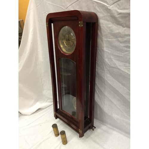 21 - AN ART NOUVEAU STYLE MAHOGANY CASED WALL CLOCK WITH BRASS AND SILVERED DIAL