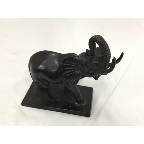 5 - A SMALL POSSIBLY BRONZE FIGURE OF AN ELEPHANT H: 14CM