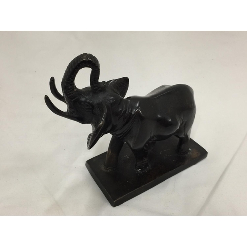 5 - A SMALL POSSIBLY BRONZE FIGURE OF AN ELEPHANT H: 14CM