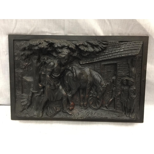 39 - A HEAVY CAST IRON VICTORIAN PLAQUE DEPICTING A FARRIER AND A HORSE