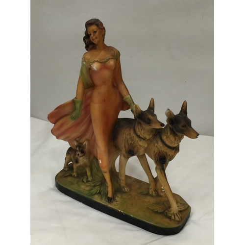 44 - AN EARLY 20TH CENTURY ART DECO STYLE CHALKWARE FIGURE OF A LADY AND TWO GERMAN SHEPHERDS MARKED RD 8... 