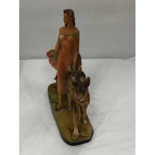 44 - AN EARLY 20TH CENTURY ART DECO STYLE CHALKWARE FIGURE OF A LADY AND TWO GERMAN SHEPHERDS MARKED RD 8... 