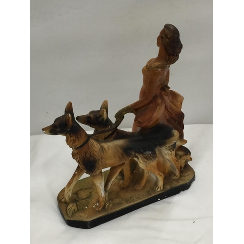 44 - AN EARLY 20TH CENTURY ART DECO STYLE CHALKWARE FIGURE OF A LADY AND TWO GERMAN SHEPHERDS MARKED RD 8... 