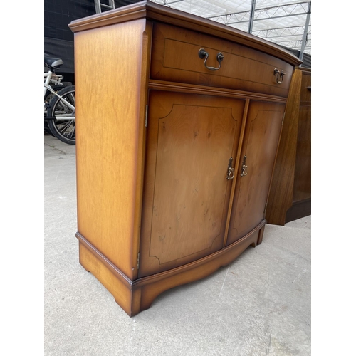 2647 - A MODERN YEW WOOD BOWFRONTED SIDEBOARD WITH TWO DRAWERS AND TWO CUPBOARDS, 31