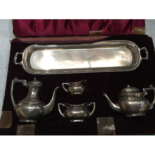 23 - A SET OF BIRMINGHAM HALLMARKED SILVER MINIATURE TEAPOTS AND JUGS IN A CASE