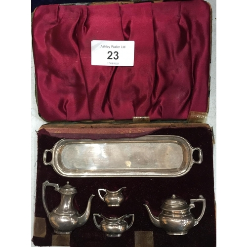 23 - A SET OF BIRMINGHAM HALLMARKED SILVER MINIATURE TEAPOTS AND JUGS IN A CASE