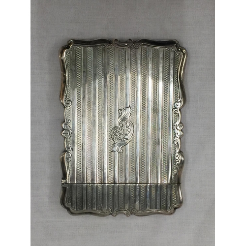 11 - A BIRMINGHAM HALLMARKED SILVER CARD CASE WITH DECORATIVE DESIGN H: 10CM. WEIGHT 70 GRAMS