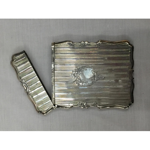 11 - A BIRMINGHAM HALLMARKED SILVER CARD CASE WITH DECORATIVE DESIGN H: 10CM. WEIGHT 70 GRAMS