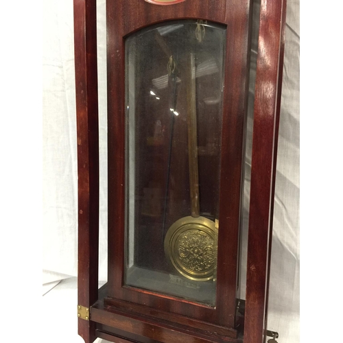 24 - AN ART NOUVEAU STYLE MAHOGANY CASED WALL CLOCK WITH BRASS AND SILVERED DIAL