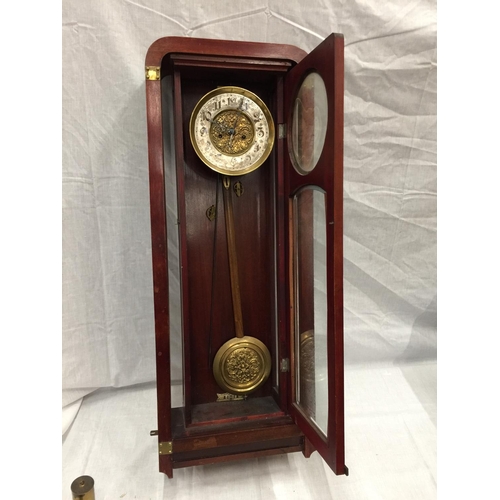 24 - AN ART NOUVEAU STYLE MAHOGANY CASED WALL CLOCK WITH BRASS AND SILVERED DIAL