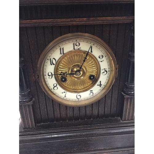 35A - AN ORNATE CHIMING MANTLE CLOCK WITH GERMAN MOVEMENT AND PENDULUM. KEY IS PRESENT AND WORKING AT TIME... 