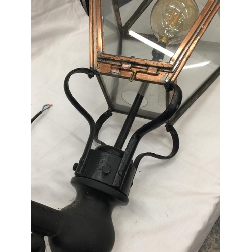 37 - A VERY LARGE VINTAGE COPPER FRAMED STREET LAMP WITH GLASS PANELS. APPROX HEIGHT: 120CM