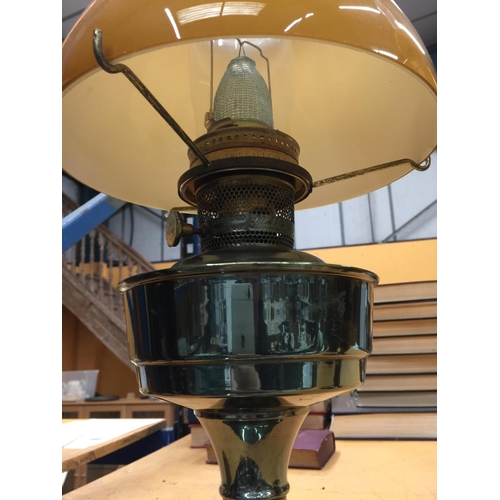 47 - A PAIR OF VINTAGE BRASS OIL LAMPS WITH APRICOT COLOURED GLASS SHADES A/F REPAIRS TO ONE GLASS SHADE