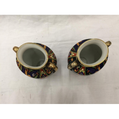 49 - A PAIR OF HAND PAINTED NORITAKE VASES WITH GILT EDGING AND BIRD DESIGN TO FRONT H: 20CM