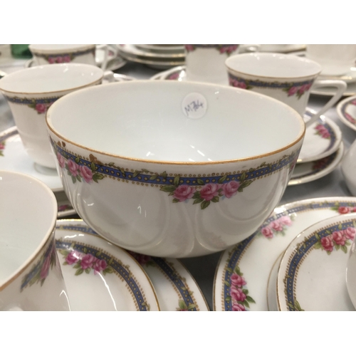 204 - A LARGE QUANTITY OF TEAWARE TO INCLUDE CUPS, SAUCERS, PLATES, CREAM JUG AND SUGAR BOWL