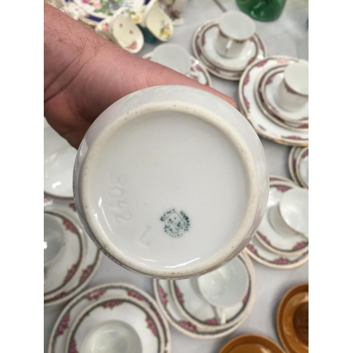 204 - A LARGE QUANTITY OF TEAWARE TO INCLUDE CUPS, SAUCERS, PLATES, CREAM JUG AND SUGAR BOWL