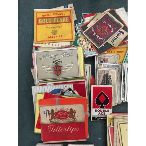 207 - A QUANTITY OF CIGARETTE CARDS INCLUDING AN ALBUM OF DOGS, VINTAGE CIGARETTE PACKS AND CIGARETTE PACK... 