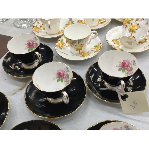 215 - TWO VINTAGE PART TEASETS TO INCLUDE ADDERLEY FLORAL BLACK CUPS AND SAUCERS PLUS ART DECO STYLE ORANG... 