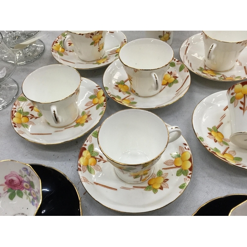 215 - TWO VINTAGE PART TEASETS TO INCLUDE ADDERLEY FLORAL BLACK CUPS AND SAUCERS PLUS ART DECO STYLE ORANG... 