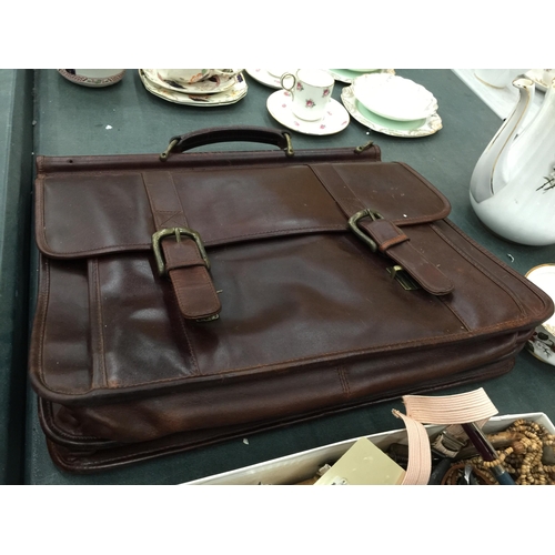 222 - A BROWN WILSON'S LEATHER BRIEF CASE WITH HANDLE