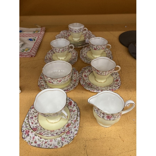 261 - A WINDSOR CHINA TEASET IN A YELLOW AND FLORAL PATTERN WITH GILT RIMS TO INCLUDE A CAKE PLATE, CREAM ... 