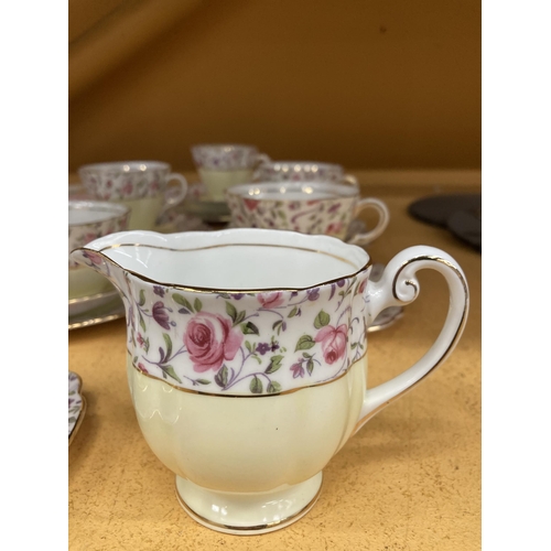 261 - A WINDSOR CHINA TEASET IN A YELLOW AND FLORAL PATTERN WITH GILT RIMS TO INCLUDE A CAKE PLATE, CREAM ... 