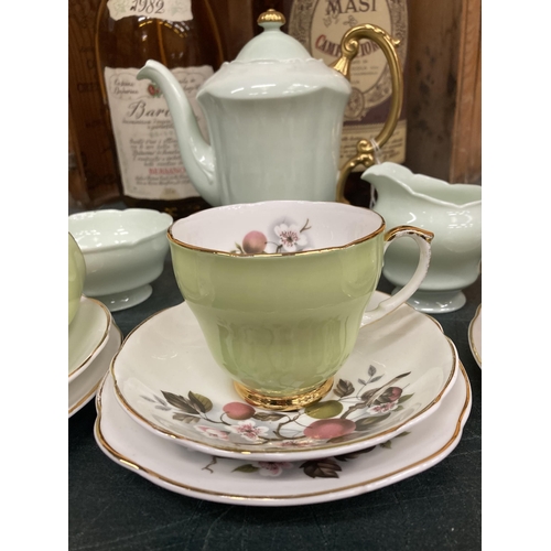 268 - A PARAGON PALE GREEN COFFEE POT, CREAM JUG AND SUGAR BOWL PLUS THREE PALE GREEN CHINA TRIOS WITH BLO... 