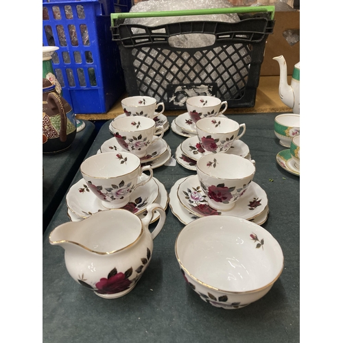 293 - A COLCLOUGH ROSE PATTERNED TEASET TO INCLUDE CREAM JUG, SUGAR BOWL CUPS, SAUCERS AND SIDE PLATES