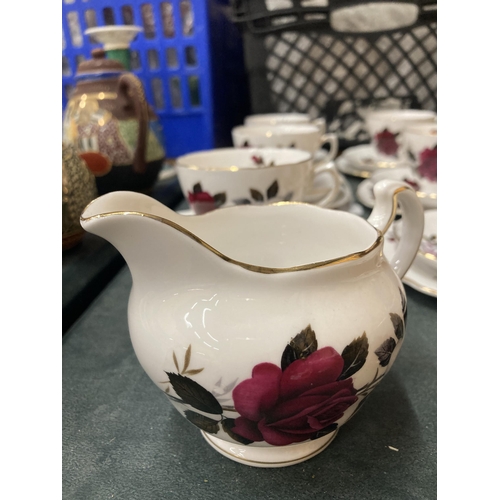 293 - A COLCLOUGH ROSE PATTERNED TEASET TO INCLUDE CREAM JUG, SUGAR BOWL CUPS, SAUCERS AND SIDE PLATES