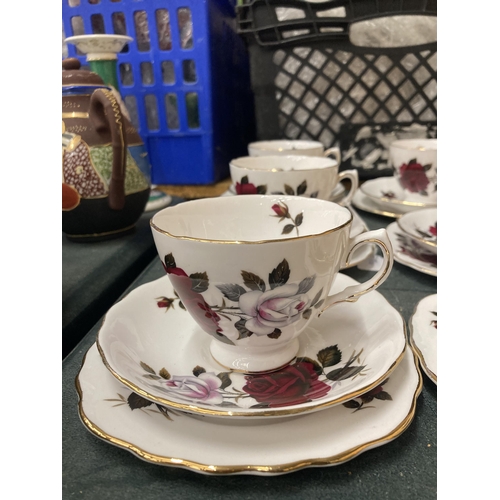 293 - A COLCLOUGH ROSE PATTERNED TEASET TO INCLUDE CREAM JUG, SUGAR BOWL CUPS, SAUCERS AND SIDE PLATES