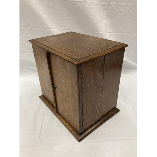 280A - AN OAK SMOKERS CABINET WITH THREE ENCLOSED DRAWERS H: 30CM, W: 32CM